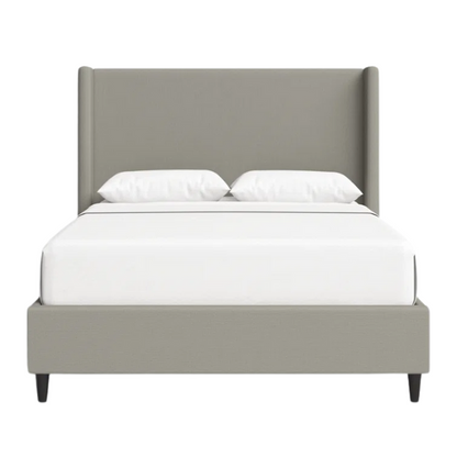 Grey canvas queen platform bed with extra-tall wingback tufted headboard and black tapered legs.

