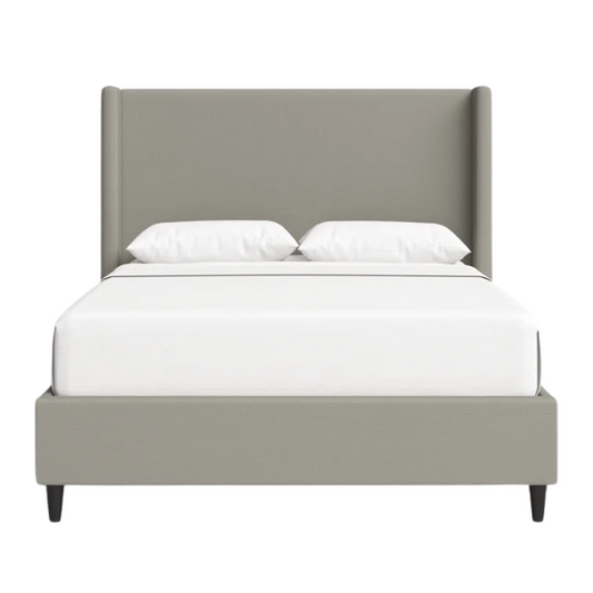 Grey canvas queen platform bed with extra-tall wingback tufted headboard and black tapered legs.

