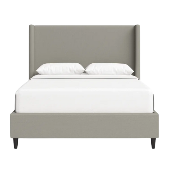 Grey canvas queen platform bed with extra-tall wingback tufted headboard and black tapered legs.

