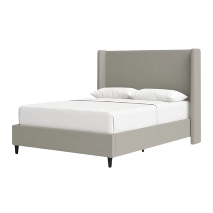 Grey canvas queen platform bed with extra-tall wingback tufted headboard and black tapered legs.

