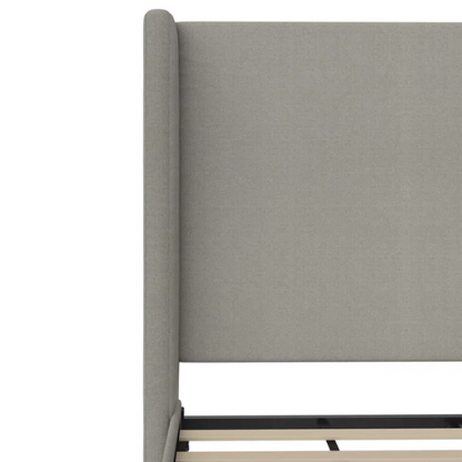 Grey canvas queen platform bed with extra-tall wingback tufted headboard and black tapered legs.

