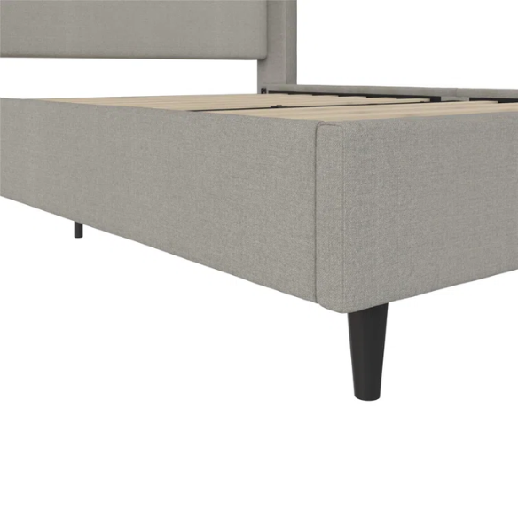 Grey canvas queen platform bed with extra-tall wingback tufted headboard and black tapered legs.

