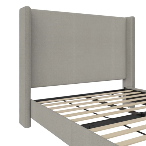 Grey canvas queen platform bed with extra-tall wingback tufted headboard and black tapered legs.

