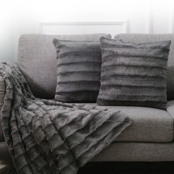 Set of two grey faux fur throw pillows, 18x18 inches, square plush decorative cushions with soft microfiber filling—perfect for modern sofas, beds, and neutral-toned interiors

