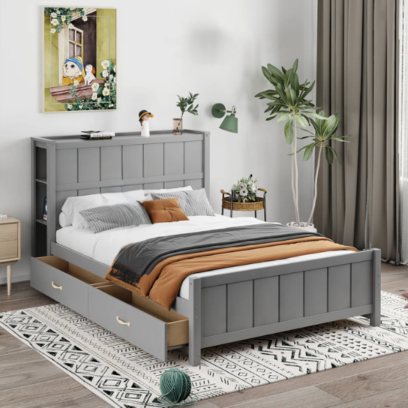 Grey full size platform bed with four underbed storage drawers, integrated headboard shelving, and solid wood slat support