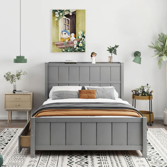 Grey full size platform bed with four underbed storage drawers, integrated headboard shelving, and solid wood slat support