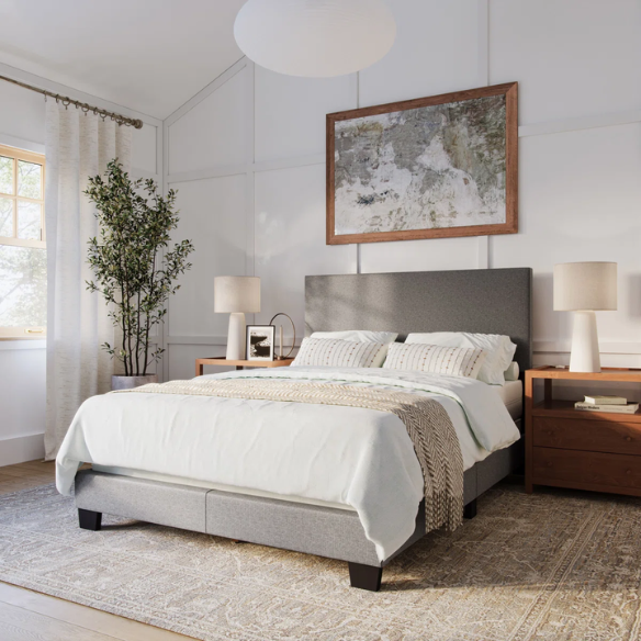 Full-size grey upholstered bed with soft polyester fabric, tall foam-padded headboard, and sleek rectangular frame design.


