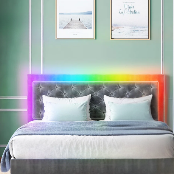 Grey full size upholstered bed frame with tufted velveteen headboard, built-in RGB LED strip lighting, and smart app control features