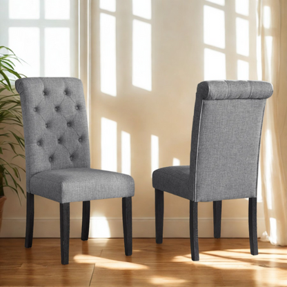 Set of 2 grey tufted high-back dining chairs with espresso-finished solid wood legs and foam-padded polyester upholstery—ideal for farmhouse and modern dining spaces.

