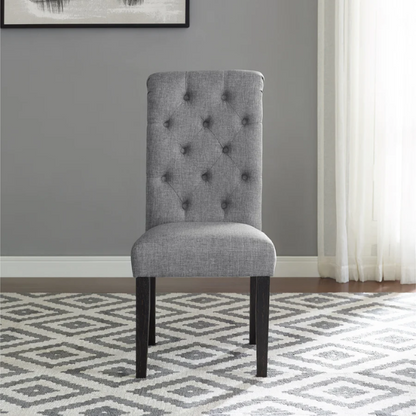 Set of 2 grey tufted high-back dining chairs with espresso-finished solid wood legs and foam-padded polyester upholstery—ideal for farmhouse and modern dining spaces.

