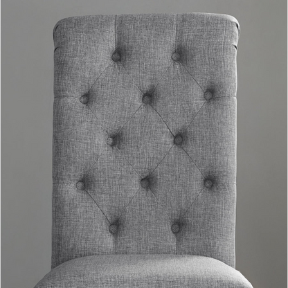 Set of 2 grey tufted high-back dining chairs with espresso-finished solid wood legs and foam-padded polyester upholstery—ideal for farmhouse and modern dining spaces.


