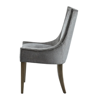 Set of 2 upholstered armless dining chairs in soft grey chenille with high backs, piped detailing, and solid wood legs.

