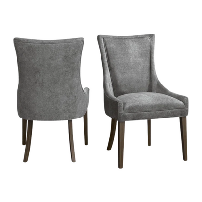 Set of 2 upholstered armless dining chairs in soft grey chenille with high backs, piped detailing, and solid wood legs.

