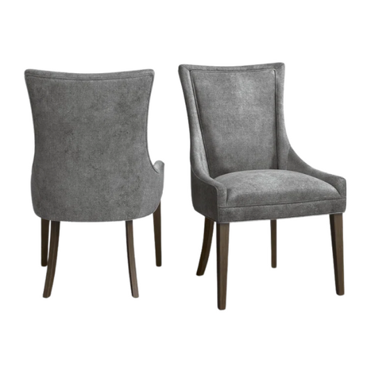 Set of 2 upholstered armless dining chairs in soft grey chenille with high backs, piped detailing, and solid wood legs.

