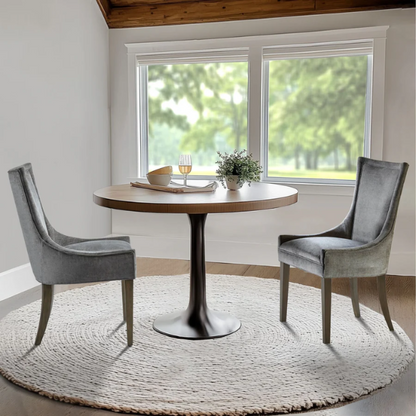 Set of 2 upholstered armless dining chairs in soft grey chenille with high backs, piped detailing, and solid wood legs.

