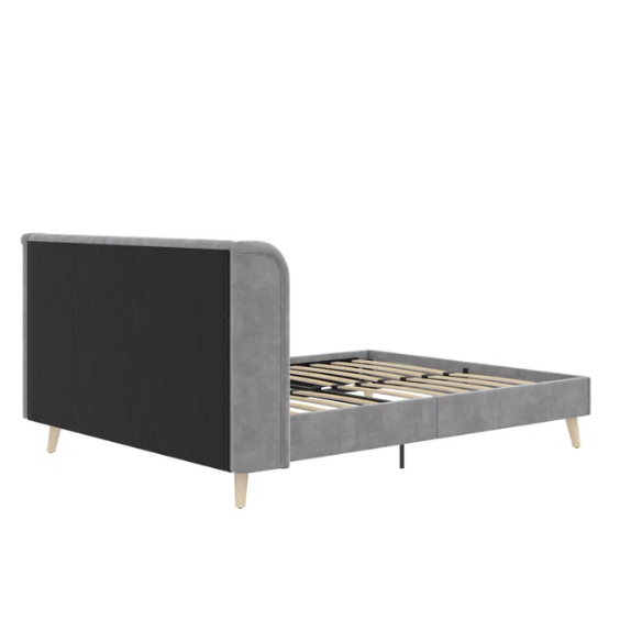 Grey velvet upholstered queen-size platform bed with wingback tufted headboard and mid-century wooden legs.

