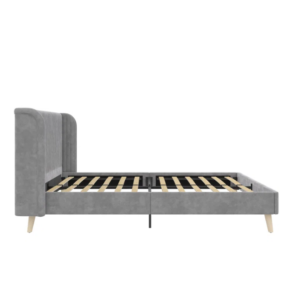 Grey velvet upholstered queen-size platform bed with wingback tufted headboard and mid-century wooden legs.

