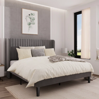 Grey velvet upholstered queen bed with tufted wingback headboard, 8-inch underbed clearance, and sturdy wood frame.


