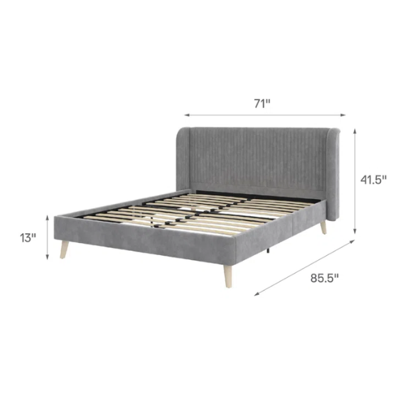Grey velvet upholstered queen-size platform bed with wingback tufted headboard and mid-century wooden legs.

