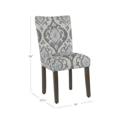 Set of two Parsons dining chairs with grey, white, and light blue floral upholstery, high back design, scalloped seat front, and wood legs