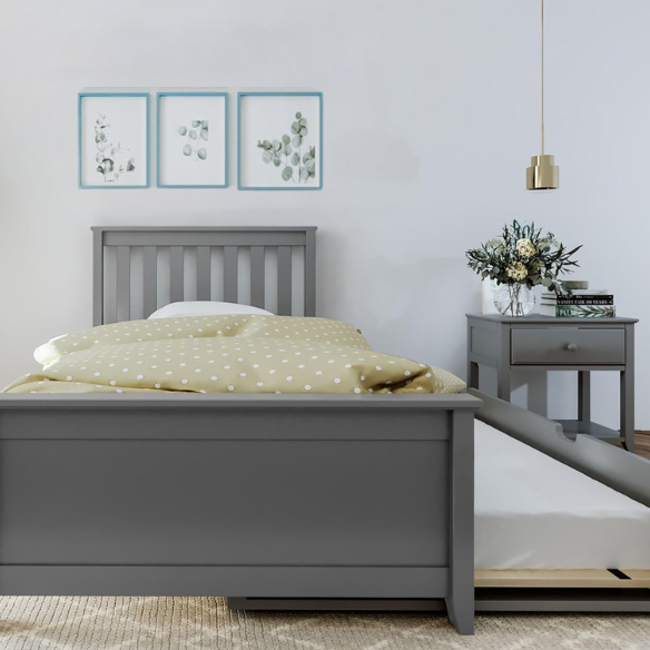 Grey solid wood twin bed with pull-out trundle, modern slatted headboard and footboard, perfect for kids’ rooms and overnight guests.