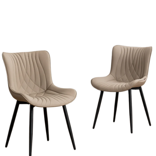 Set of 2 khaki faux leather dining chairs with fishtail tufted backs and black metal legs, styled for modern and transitional interiors.

