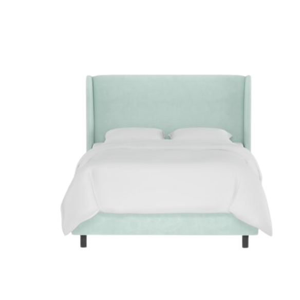 Light aqua king-size upholstered bed in velvet fabric with wingback headboard and low-profile black metal legs.

