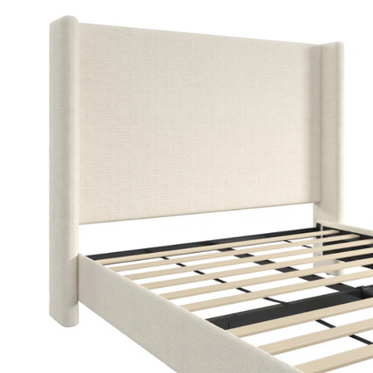 Light cream boucle queen-size platform bed with tall wingback tufted headboard and black tapered legs.

