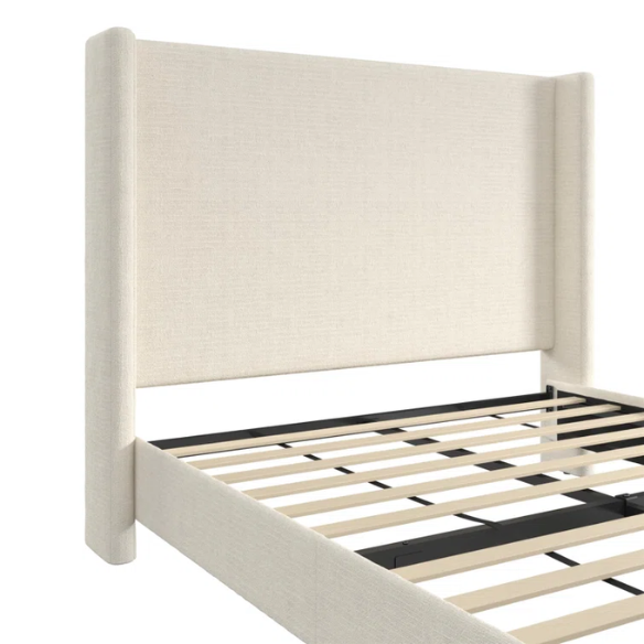 Light cream boucle queen-size platform bed with tall wingback tufted headboard and black tapered legs.

