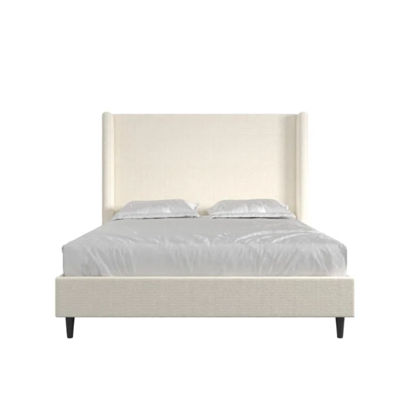 Light cream boucle queen-size platform bed with tall wingback tufted headboard and black tapered legs.

