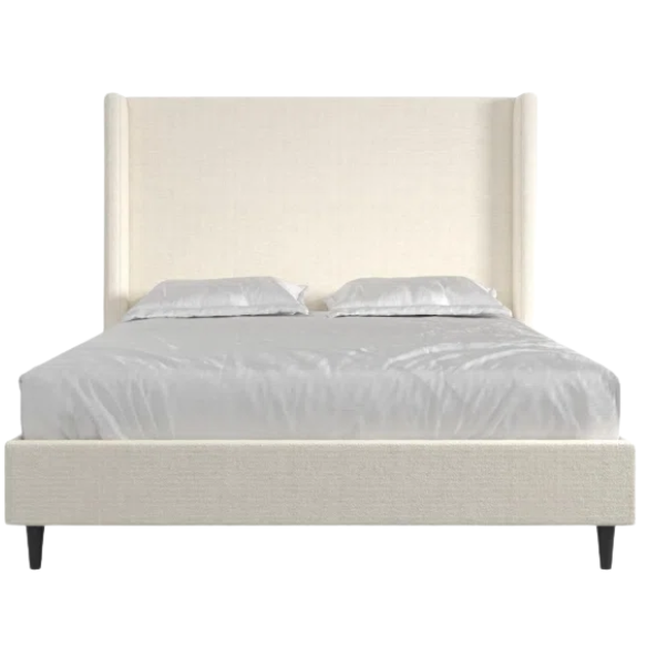 Light cream boucle queen-size platform bed with tall wingback tufted headboard and black tapered legs.

