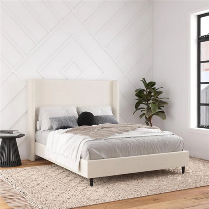 Light cream boucle queen-size platform bed with tall wingback tufted headboard and black tapered legs.

