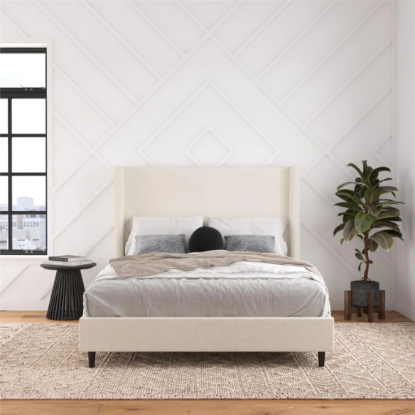 Light cream boucle queen-size platform bed with tall wingback tufted headboard and black tapered legs.

