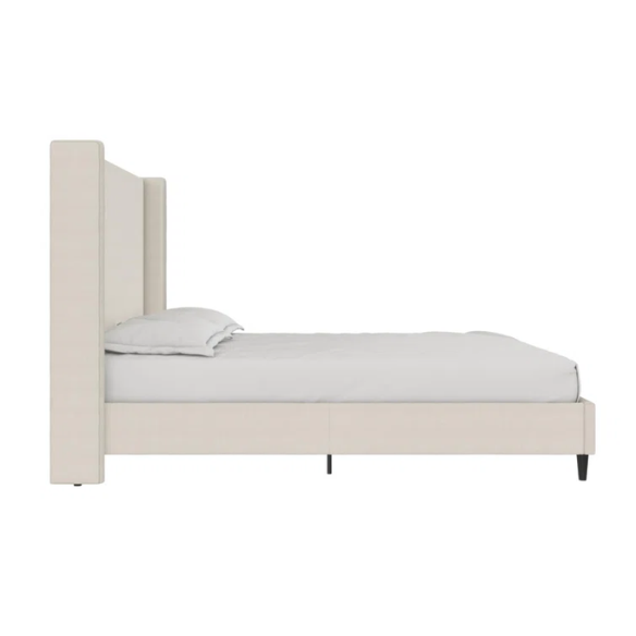 Light cream canvas upholstered queen-size bed with extra-tall wingback tufted headboard and black tapered legs.

