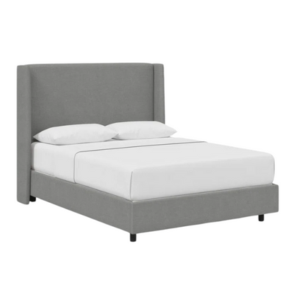 Light grey king-size upholstered bed in linen fabric with wingback headboard and low-profile black metal legs.

