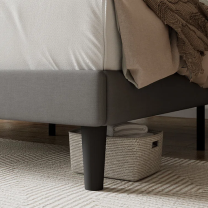Light grey upholstered queen bed with linen fabric, button-tufted adjustable headboard, and 8-inch underbed clearance for extra storage.

