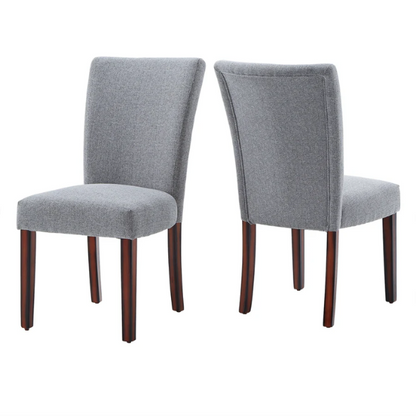 Set of 2 upholstered Parson dining chairs in light grey fabric with espresso-finished wood legs and padded high backs, ideal for dining or accent seating.

