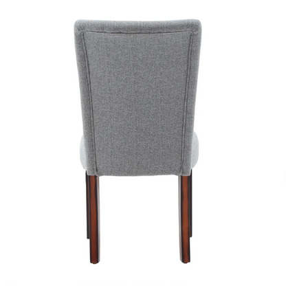 Set of 2 upholstered Parson dining chairs in light grey fabric with espresso-finished wood legs and padded high backs, ideal for dining or accent seating.

