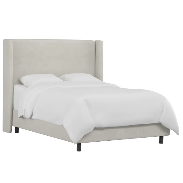 Light grey king-size upholstered bed with performance velvet fabric, wingback headboard, and low-profile black metal legs.

