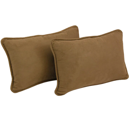 Set of 2 medium brown microsuede lumbar throw pillows with piped edges on couch