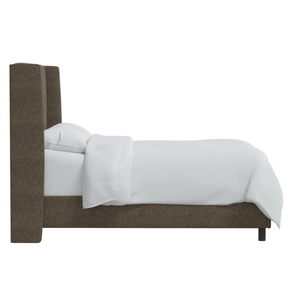Medium brown king-size upholstered bed in tweed fabric with wingback headboard and low-profile black metal legs.


