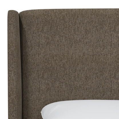 Medium brown king-size upholstered bed in tweed fabric with wingback headboard and low-profile black metal legs.

