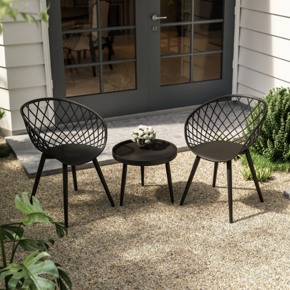 Set of two black mid-century modern chairs with matte plastic seats and angled steel legs.


