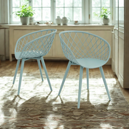 Set of two light blue mid-century modern dining chairs with molded plastic seats and black metal legs.


