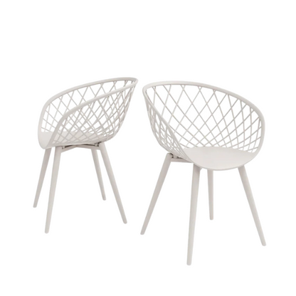 Set of two matte white mid-century modern dining chairs with molded plastic seats and black metal legs.

