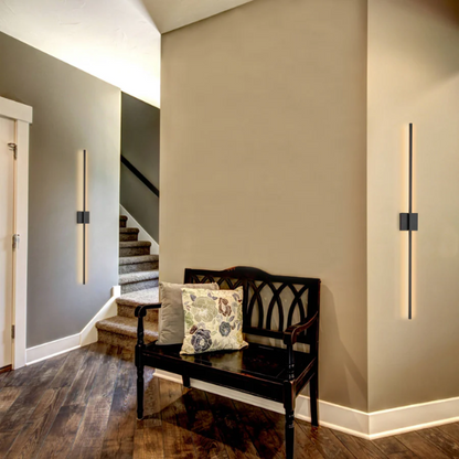 Modern black linear LED wall sconce with matte finish, designed for vertical or horizontal installation in contemporary interiors