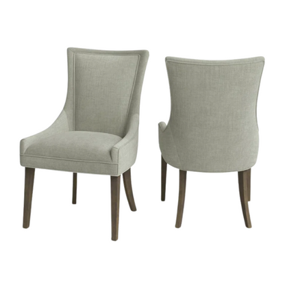 Set of 2 upholstered armless dining chairs in muted green with solid wood legs, high backrest, and elegant piping detail.


