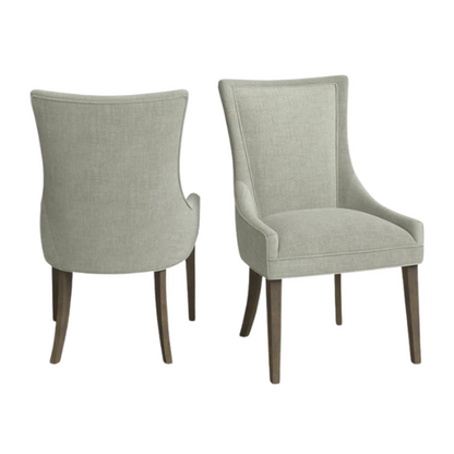 Set of 2 upholstered armless dining chairs in muted green with solid wood legs, high backrest, and elegant piping detail.

