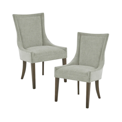 Set of 2 upholstered armless dining chairs in muted green with solid wood legs, high backrest, and elegant piping detail.

