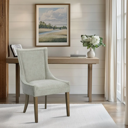 Set of 2 upholstered armless dining chairs in muted green with solid wood legs, high backrest, and elegant piping detail.

